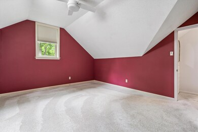 Additional living space featuring carpet floors, c