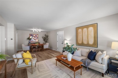 Living room with wood finished floors and baseboards