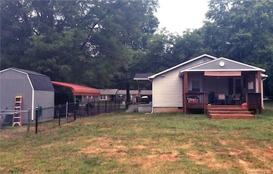 Backyard, fully fenced. Deck recently added.