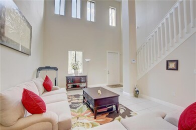 Formal Living Room With High Ceiling