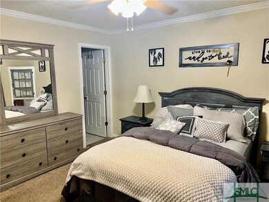 Primary bedroom, with bathroom in the door on the