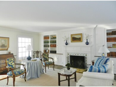 The elegant living room features Grecian Key moldi