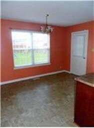 Dining area is large enough for a table for six and a hutch or side board.  Door to patio.