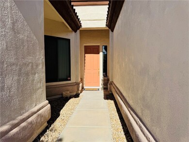 Entrance to property with stucco siding