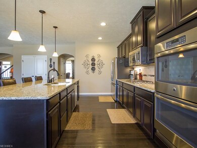 Double ovens, gas cooktop, expresso hardwood floor