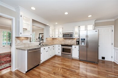 stainless appliances, white cabinets, and in cabin