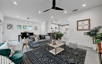 Living room with visible vents, baseboards, a cei