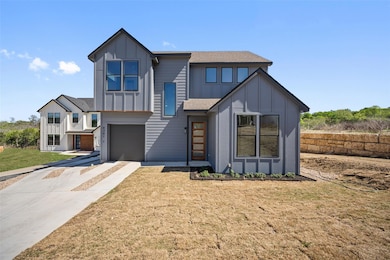 View of front facade with board and batten siding