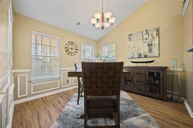 Dining space with vaulted ceiling, wood finished f