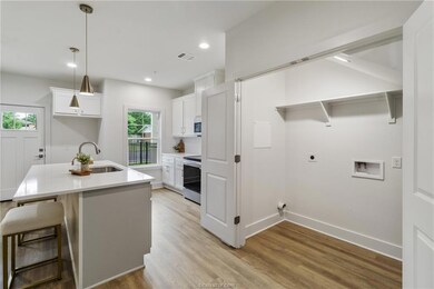 Kitchen with stainless steel range with electric s
