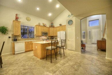 Kitchen Area Overlooks the Family Room