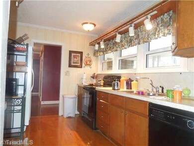 Kitchen. Kitchen area opens to Dining Room, Foyer and Den area.