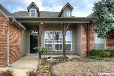 Inviting front entrance features professional land