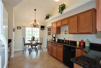 Open kitchen with granite counter tops, deep sink 