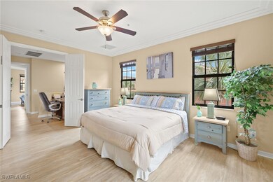 Bedroom with light wood-style flooring, an office