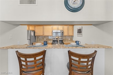 Kitchen featuring tasteful backsplash, a breakfast