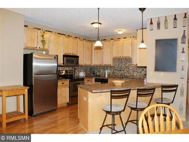 Large kitchen with wood floors, SS appliances, ton