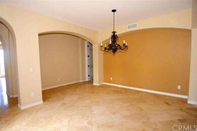 Formal dining room with travetine flooring.