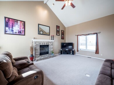 Vaulted 2 story great room with gas log fireplace.