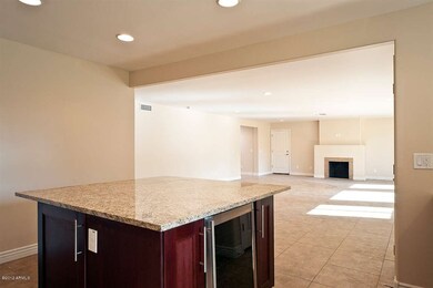 KITCHEN WITH ISLAND W/WINE FRIG.