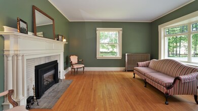 Parlor with fireplace and leaded windows