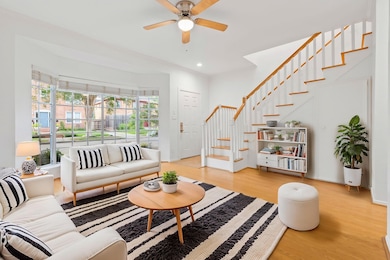 Sun drenched living room with Bay Windows overlook