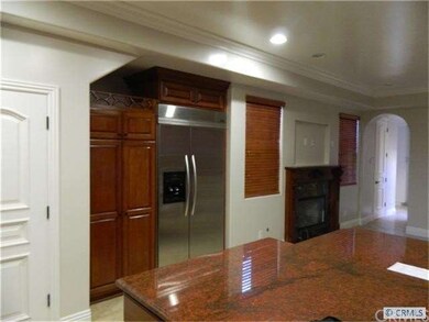 Kitchen view of eating area and fireplace