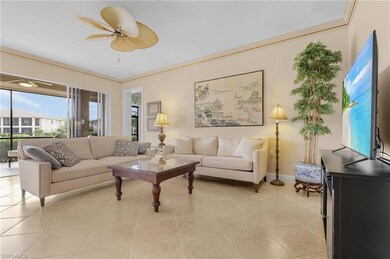 Tiled living room with ceiling fan and ornamental 