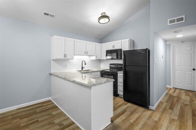 The kitchen has been upgraded with granite countertops and all new cabinets