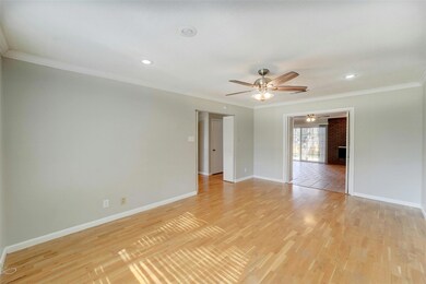 Empty room with ornamental molding, baseboards, l