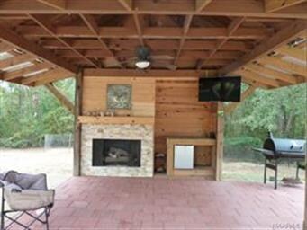 Outside entertainment area by Pool. Has Fireplace 