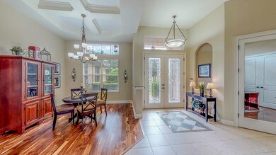 Formal dining room, foyer, and office/den.