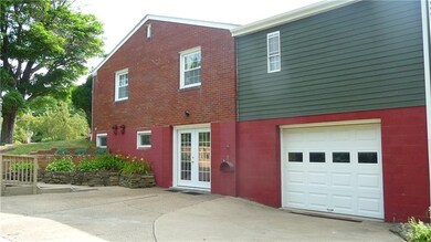 Side view shows 1 car integral garage, French door