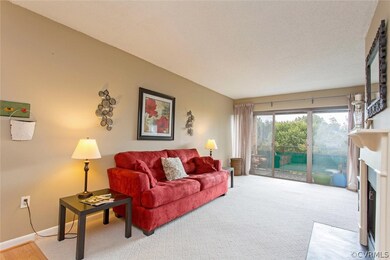 Another view of living room with sliders to privat