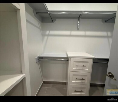 Spacious closet featuring tile patterned floors