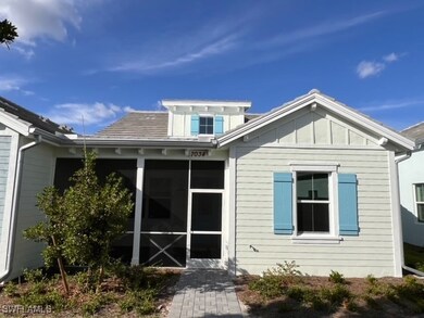 Rear view of house with a sunroom