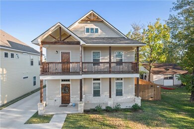 View of front of house featuring covered porch and