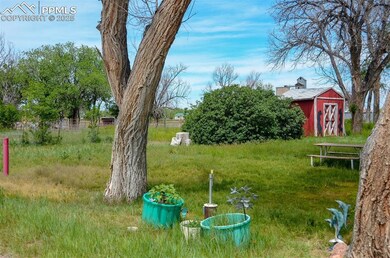 View of yard featuring a storage shed