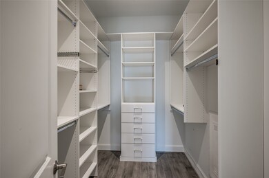 The walk-in closet is a masterpiece of design, fea
