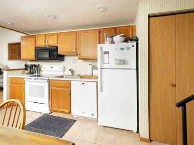 Kitchen includes a laundry in the door on the righ