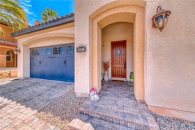 Entrance to property featuring a garage, decorativ