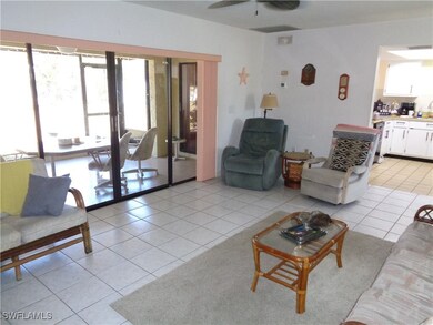 Living room featuring light tile patterned floors