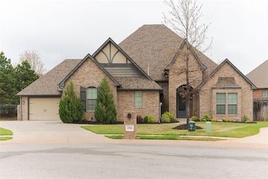View of front of house with a garage, roof with sh