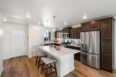 Kitchen featuring appliances with stainless steel