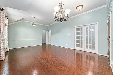 With flowing lines, creating a seamless transition between spaces.