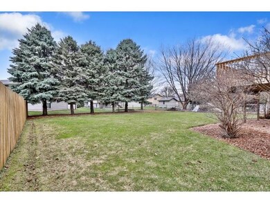 The back yard is large and flat, and 3 of 4 neighb