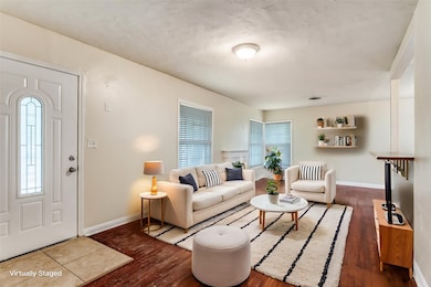 Living area with dark wood-style flooring