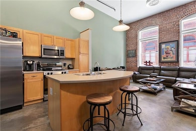 Kitchen with stainless steel appliances, a sink, f