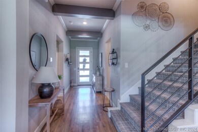 Wide entry and wide stairway. Hardwoods