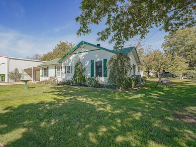 View of front of property located on a large corner lot!